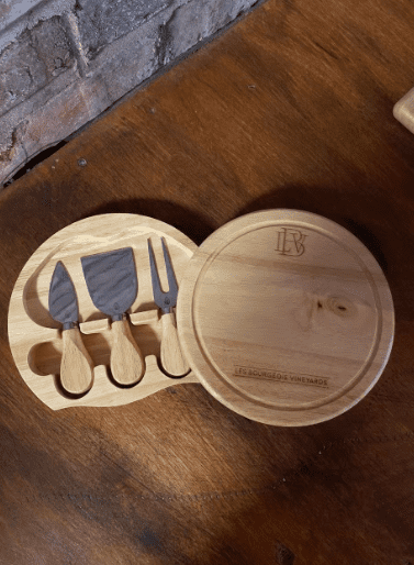 wooden container with tools for a cheese board