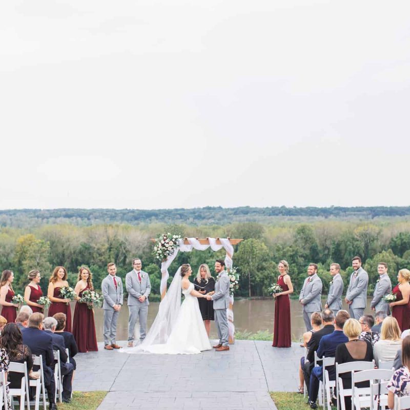 A couple stands at the altar to be married on The Blufftop at Rocheport